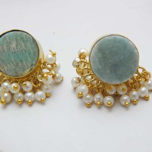 Gold-tone stud earrings with a round, teal/aqua Amazonite stone and a border of dangling white pearl clusters.