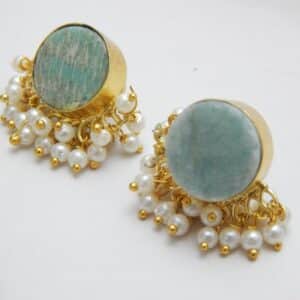 Gold-tone stud earrings with a round, teal/aqua Amazonite stone and a border of dangling white pearl clusters.