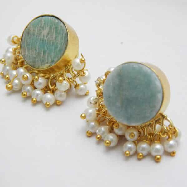 Gold-tone stud earrings with a round, teal/aqua Amazonite stone and a border of dangling white pearl clusters.