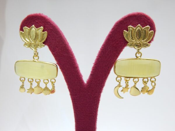 A pair of polished gold-tone earrings with a lotus stud and a horizontal, rectangular yellow stone dangle.