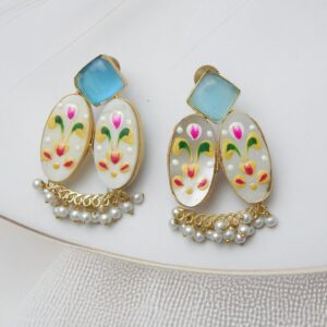 Gold-tone fusion earrings with a geometric stone stud, patterned floral ovals (mother-of-pearl look), and white pearl dangles.