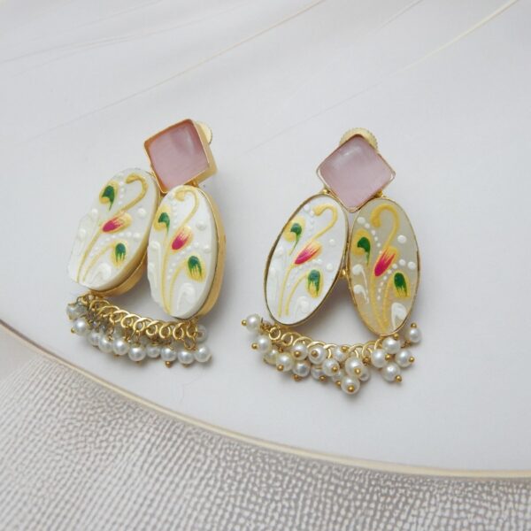Gold-tone fusion earrings with a geometric stone stud, patterned floral ovals (mother-of-pearl look), and white pearl dangles.