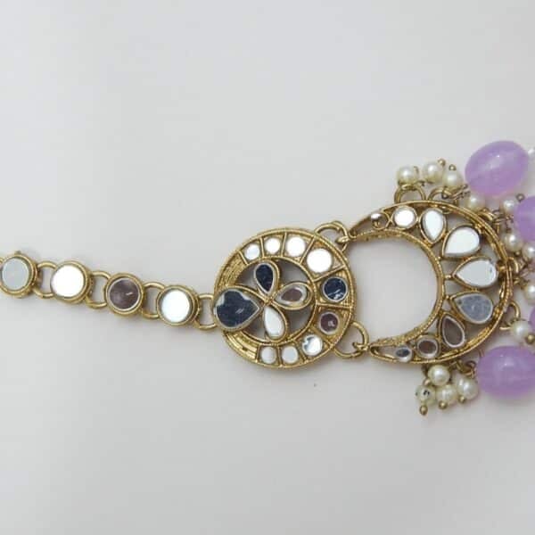 An ethnic mirror work chandbali earring and maang tikka set with beaded drops and small pearls