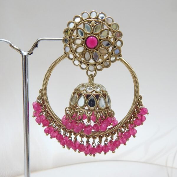 Navratri Purple Jewellery - Royal Reflection DS A pair of large, traditional hoop jhumka earrings with intricate mirror work on the top stud and bell, and a cluster of dangling dark pink colored beads on the bottom.