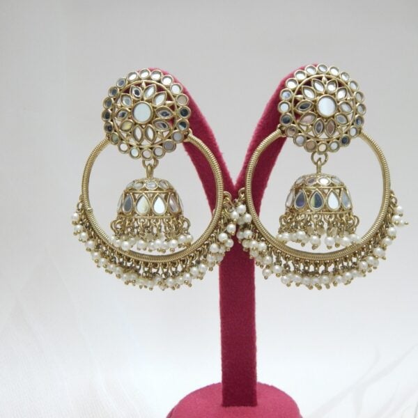 Navratri White Jewellery - Royal Reflection DS A pair of large, traditional hoop jhumka earrings with intricate mirror work on the top stud and bell, and a cluster of dangling white colored beads on the bottom.