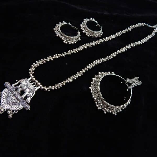 Complete German Silver tribal jewelry set: Long ghungroo beaded necklace with elephant pendant and two pairs of matching oxidized jhumka hoops.