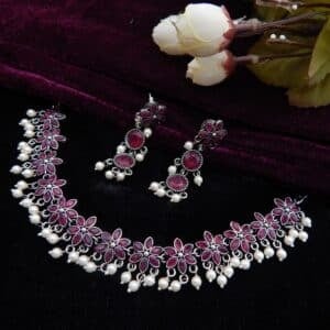 Oxidised floral choker set with pearl drops and matching earrings in dark pink