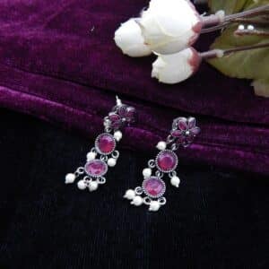 Dangle earrings with dark pink stone floral links and white faux pearl drops