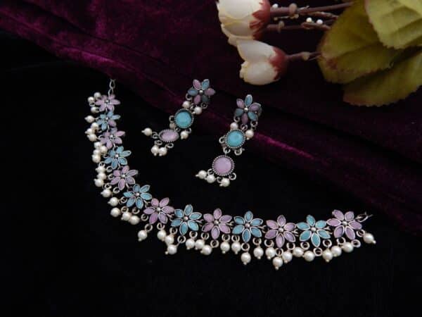 Oxidised floral choker set with pearl drops and matching earrings in multi color