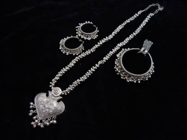 Oxidised silver heart pendant necklace set with ghungroo chain and matching bali earrings