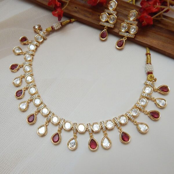 Tarana Kundan choker necklace with teardrop drops in red green and pink for Indian wedding styling.