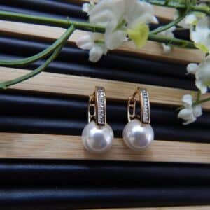 Timeless Pearl Huggie Hoops-stand