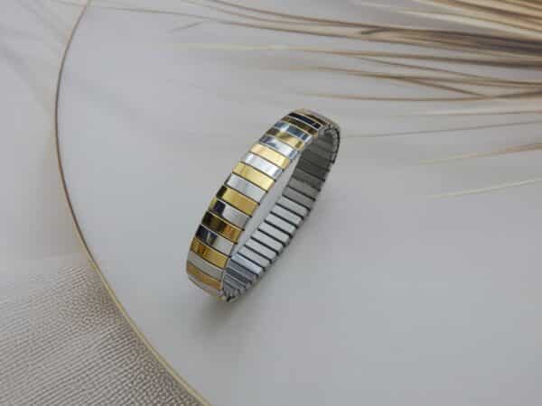 stainless steel gold stretch bracelet standing upright – Royal Reflection Dazzling Studio.