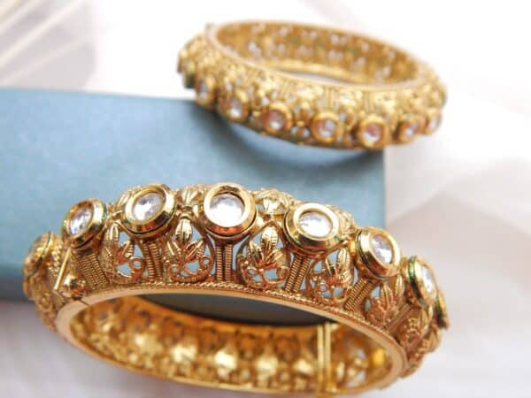 Traditional gold-plated filigree Kundan kada with antique design and clear stones – Devika Heritage Kada by Royal Reflection Dazzling Studio.