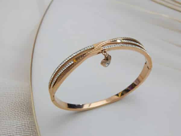 Rose gold triple-line crystal kada with dangling stone charm – Ishya Charm Kada.