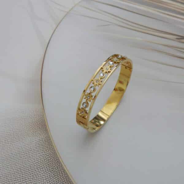 Gold star-studded kada with crystal stones – Nakshatra Star Kada.