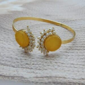 Pearl stone open cuff bracelet in amber with pearl cluster detail — gold finish