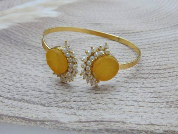 Pearl stone open cuff bracelet in amber with pearl cluster detail — gold finish