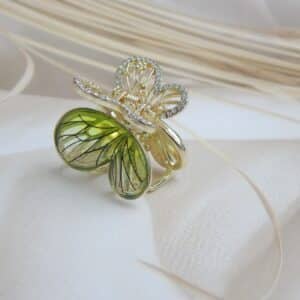 Golden butterfly hair clip with green enamel wings and CZ stones – Tara Green Butterfly Hair Claw.