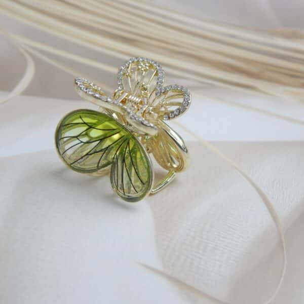 Golden butterfly hair clip with green enamel wings and CZ stones – Tara Green Butterfly Hair Claw.