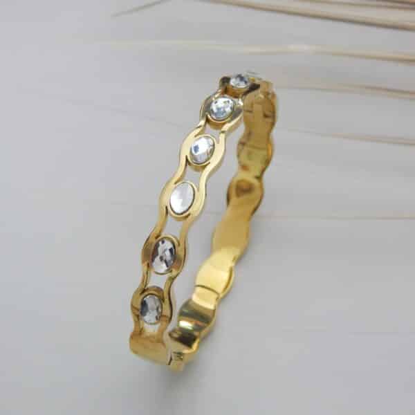 Gold wavy kada with round crystal stones – Tarini Crystal Wave Kada.