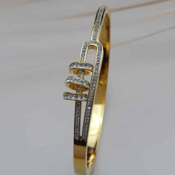 Side view of gold-plated spiral crystal bracelet – Royal Reflection Dazzling Studio.