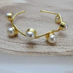 Gold-plated wavy design kada with round pearl accents – Aarika Wave Pearl Kada.