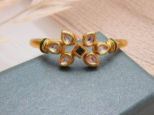 Gold-plated kada with green square centre stone and vertical kundan floral design – Aarunya Green Kundan Vertical Kada.