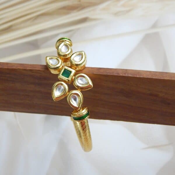 Gold-plated kada with green square centre stone and vertical kundan floral design – Aarunya Green Kundan Vertical Kada.