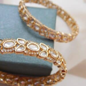 Gold-plated Polki stone bridal kada with intricate oval and teardrop design – Devika Polki Royal Kada by Royal Reflection Dazzling Studio.