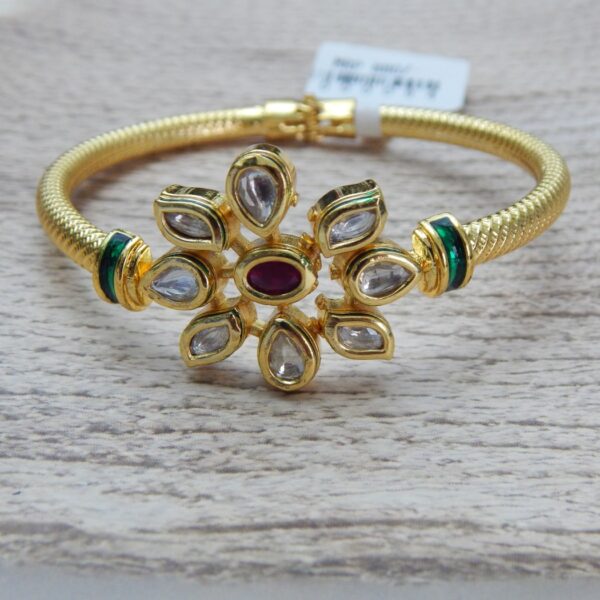 Gold-plated kada with ruby centre stone and kundan floral design – Ridhima Ruby Kundan Floral Kada.