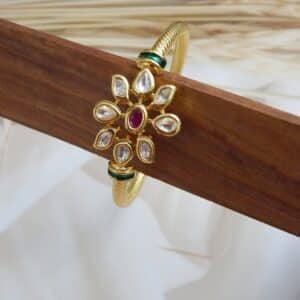 Gold-plated kada with ruby centre stone and kundan floral design – Ridhima Ruby Kundan Floral Kada.