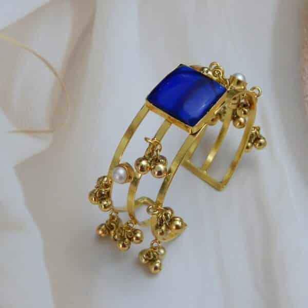 Gold-plated kada with square blue stone and ghungroo charm detailing – Rishika Ghungroo Kada.