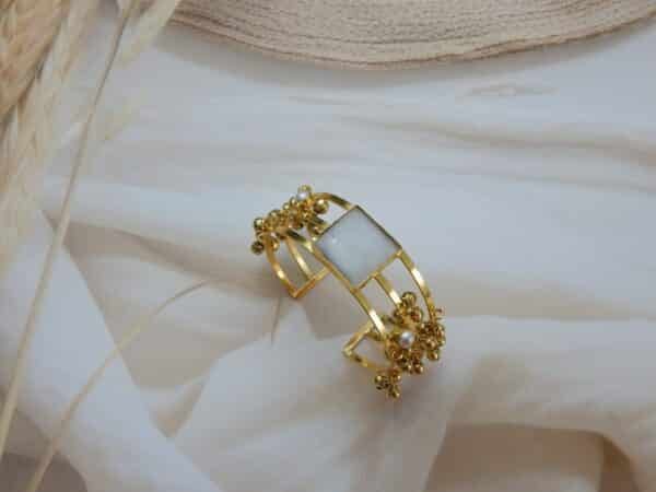 Gold ghungroo kada with white square stone and clustered bell charms — white variant