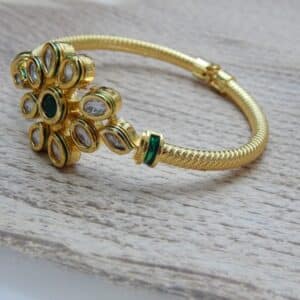 Gold-plated floral kundan kada with green center stone – Samaira Kundan Floral Kada.