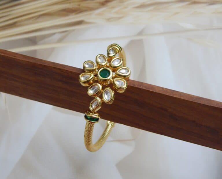 Gold-plated floral kundan kada with green center stone – Samaira Kundan Floral Kada.