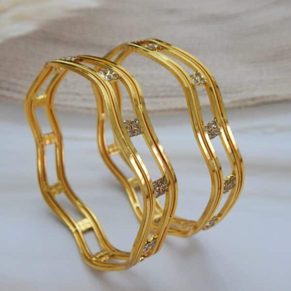 Gold-plated wave design bangle with CZ stone clusters – Zayana Wave CZ Bangle.