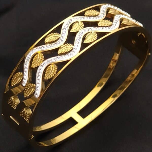 Anti tarnish kada for women in antique gold leaf design with American diamond stones shown from side angle