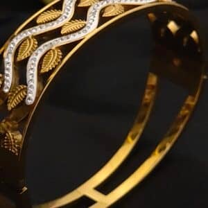 zoom of Anti tarnish kada for women in antique gold leaf design with American diamond stones