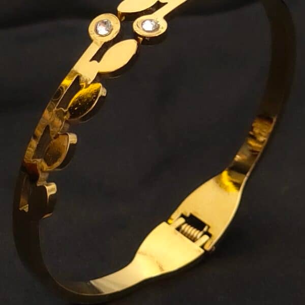 zoom of Floral anti tarnish kada for women in gold-toned vine design with American diamond stones