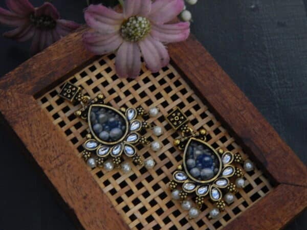 Kundan style teardrop dangler earrings in grey with mirror petal halo