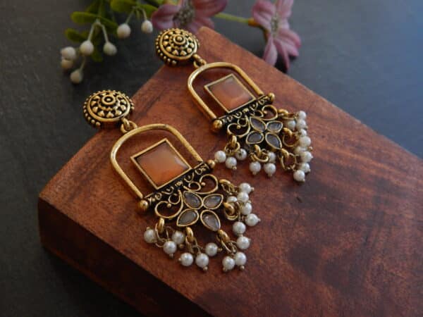 Oxidised Afghani dangler earrings in amber with pearl tassel drop