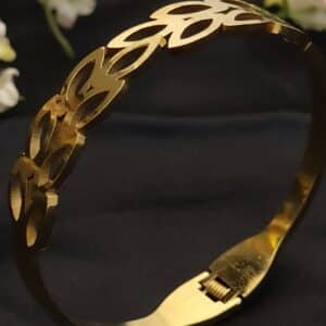 zoom of Petal anti tarnish kada for women in gold-toned interlocking petal design