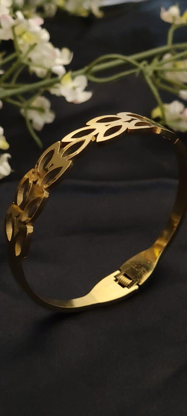 zoom of Petal anti tarnish kada for women in gold-toned interlocking petal design