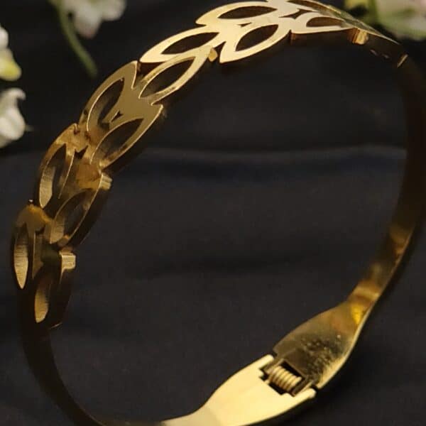 zoom of Petal anti tarnish kada for women in gold-toned interlocking petal design