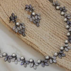 Victorian pearl vine necklace set with pavé leaf clusters and pearls, with matching drop earrings
