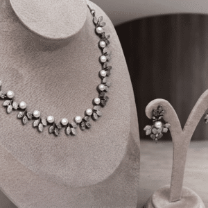 Victorian pearl vine necklace set with pavé leaf clusters and pearls, with matching drop earrings