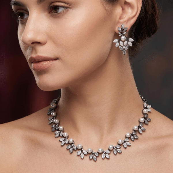 Victorian pearl vine necklace set with pavé leaf clusters and pearls, with matching drop earrings