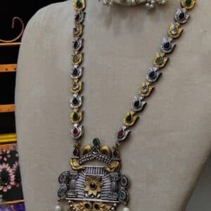 Close-up of jharokha pendant on multicolour temple necklace with twin bird motif