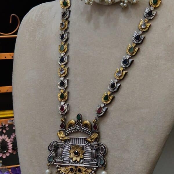 Close-up of jharokha pendant on multicolour temple necklace with twin bird motif